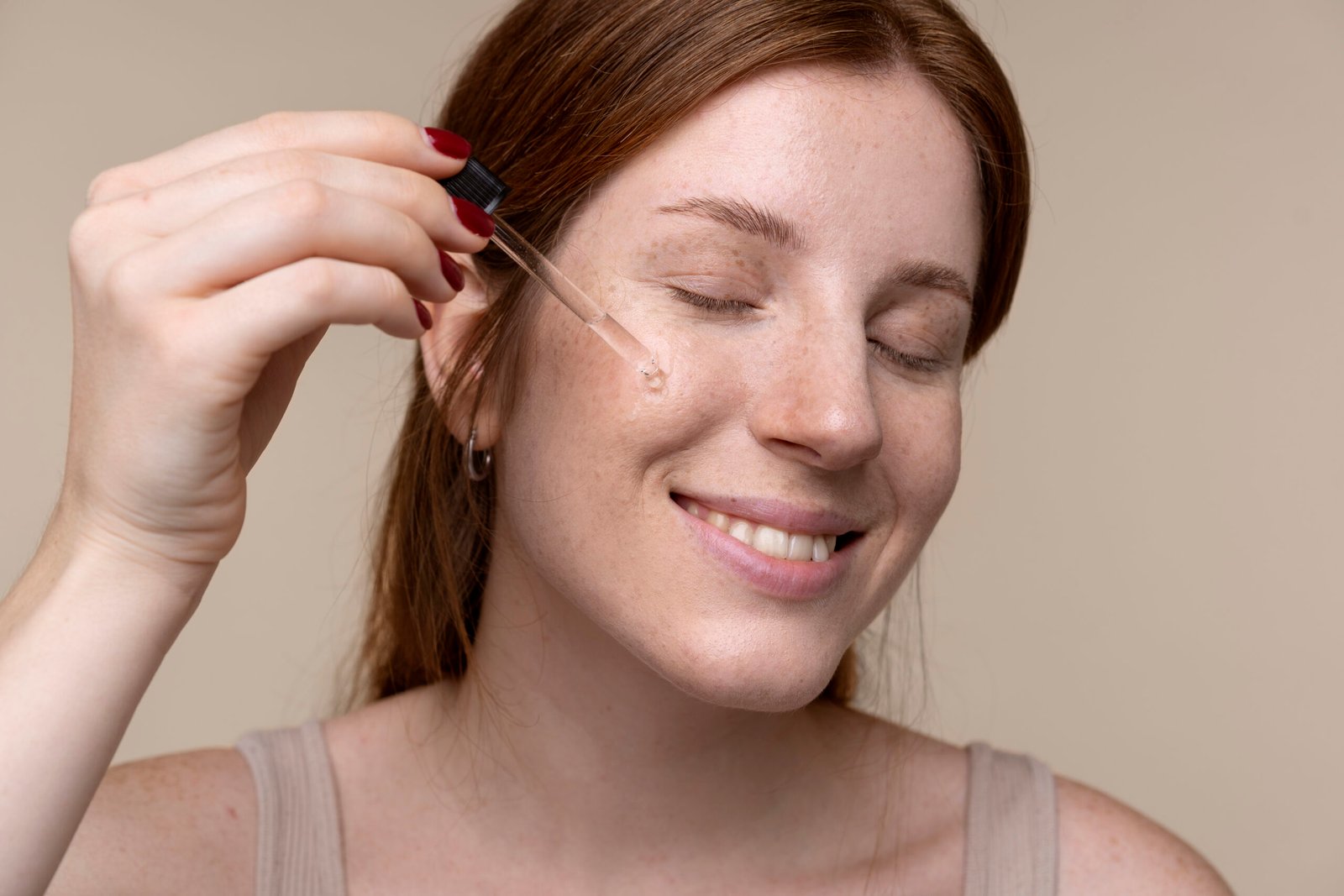 portrait-young-woman-pouring-serum-her-face
